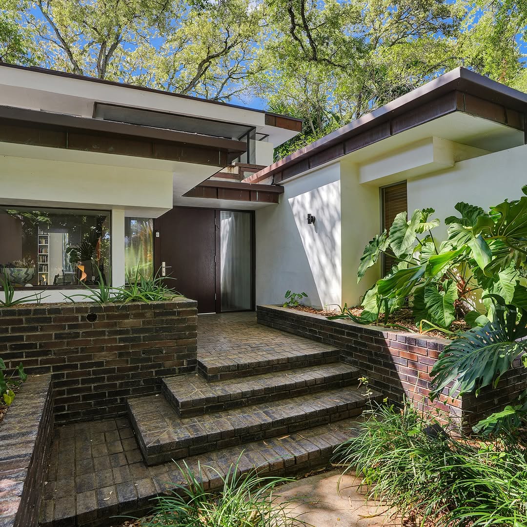 The Charm of a Home Enveloped by a Full Canopy of Mature Oak Trees